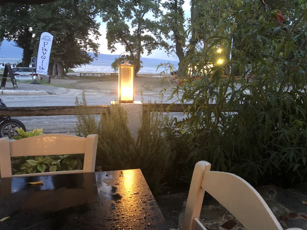 A table at dusk with the sea in the background